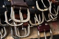 Several silver buckles of leather belts for sale at a flea marke