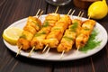 several skewered fish fillets coated in a rich marinade