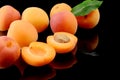 Several sliced apricots isolated on black