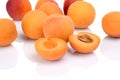 Several sliced apricots on white