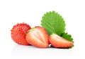 Several sliced strawberries with leaf