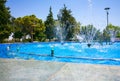 Several small fountains in a beautiful park