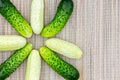 Several small star shaped cucumbers of different varieties on a wicker napkin