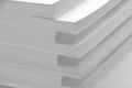 Several stacks of white paper on a white background Royalty Free Stock Photo