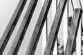 Several steel square pipes are arranged parallel to each other. Black and white photo Royalty Free Stock Photo