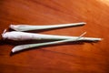 Several stems of CymbopogonÂ orÂ Lemongrass, on a natural brown wooden background