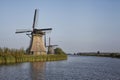 Several stone brick Dutch windmills at Kinderdijk, an UNESCO world heritage site Royalty Free Stock Photo