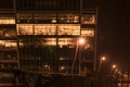 Several stories of Windowed Office Building Lit