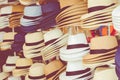 Several straw hats in a flea market