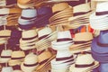 Several straw hats in a flea market