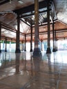 several supporting pillars made of teak tree trunks