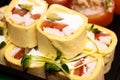 Several Sushi roll close-UPS that are wrapped in pancakes