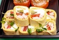 Several Sushi roll close-UPS that are wrapped in pancakes