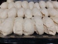 Several sweet filled pies ready for baking, lying on a baking sheet, top view Royalty Free Stock Photo