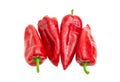 Several sweet red Kapia peppers on a light background Royalty Free Stock Photo