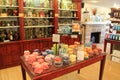 Several tables and wood shelves holding candles, and oils, Lifetime Candle Shop, Lancaster, PA, 2016