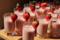 Several tall glasses of fruit smoothies