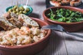 Several tapas dishes on the top of a wooden table Royalty Free Stock Photo