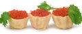 Several tartlets filled to the brim with red caviar, with parsley leaves sticking up Royalty Free Stock Photo