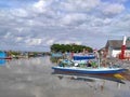 Several traditional fishing wooden boats anchored in the river