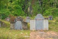 Several traditional graves in the middle of fields