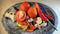 Several types of ingredients on a mortar that is ready to be mashed into chili sauce. Royalty Free Stock Photo