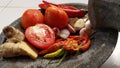 Several types of ingredients on a mortar that is ready to be mashed into chili sauce. Royalty Free Stock Photo