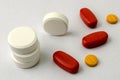 Several types of pills or tablets, maybe narcotic, antibiotic or aspirin, on light background. Medicine and pharmacy concept