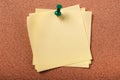 Several untidy sticky post notes pinned to cork board Royalty Free Stock Photo