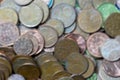 several used euro cent coins stacked on top of each other, blurred image