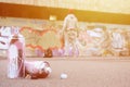 Several used spray cans with pink and white paint lie on the asp Royalty Free Stock Photo