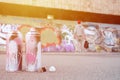 Several used spray cans with pink and white paint lie on the asp Royalty Free Stock Photo