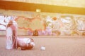 Several used spray cans with pink and white paint lie on the asp Royalty Free Stock Photo