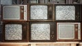 Several vintage TVs in an old building. TVs from the 70s and 80s, retro TVs with poor signal reception. Old televisions