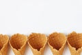 Several waffle cones lined in tower, smile, or even row, top vie Royalty Free Stock Photo