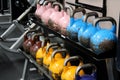 Well-used kettle balls arranged on stands at local gym, Saratoga New York, 2019