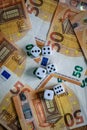 Several white dice and euro money Royalty Free Stock Photo
