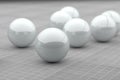 Several white futuristic balls on ceramic floor