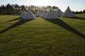 Several white pointed teepees, England, UK