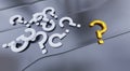 Several White Question Mark and One Big Gold Question Mark put on a Grey Metallic surface with soft reflections