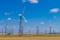 Several wind turbines on blue sky background Royalty Free Stock Photo