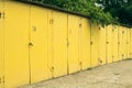 Several yellow numbered car garage outdoors