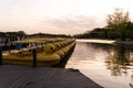 several yellow paddleboats parked in the water on a dock Royalty Free Stock Photo