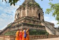 Several young monks walked by Wat Chedi Luang