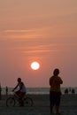 Several young people enjoying an amazing sunset in the main beach of Jericoacoara, Brazil