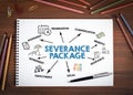 SEVERANCE PACKAGE Concept. Notebooks, pen and colored pencils on a wooden table Royalty Free Stock Photo