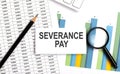 SEVERANCE PAY text on white card on the chart background