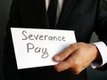 Severance Pay written on envelope with money