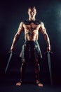 Severe barbarian in leather costume with sword Royalty Free Stock Photo