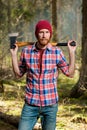 Severe bearded forester with an ax vertical portrait